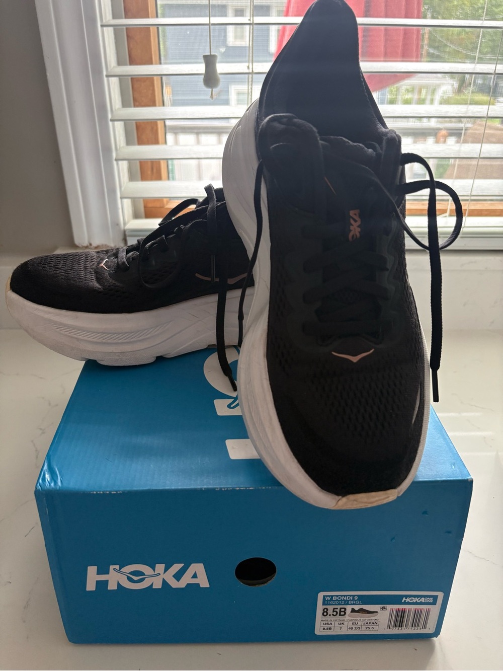 Hoka women’s Black and White Athletic Running Shoes